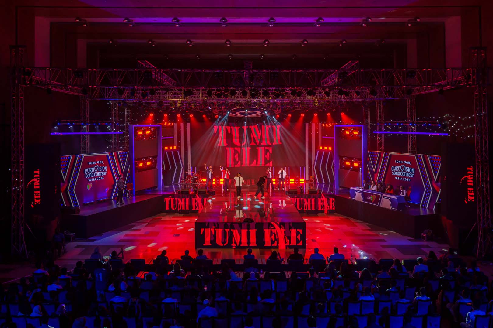 Beatmosphere performing Tumi Ele under red LED visuals with the band name on screen